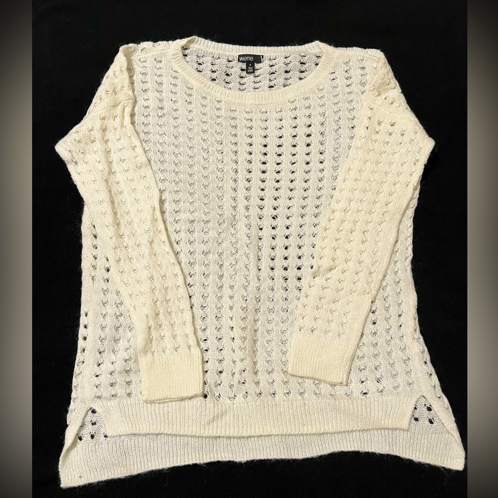 Women’s cream sweater with holes. Size small.